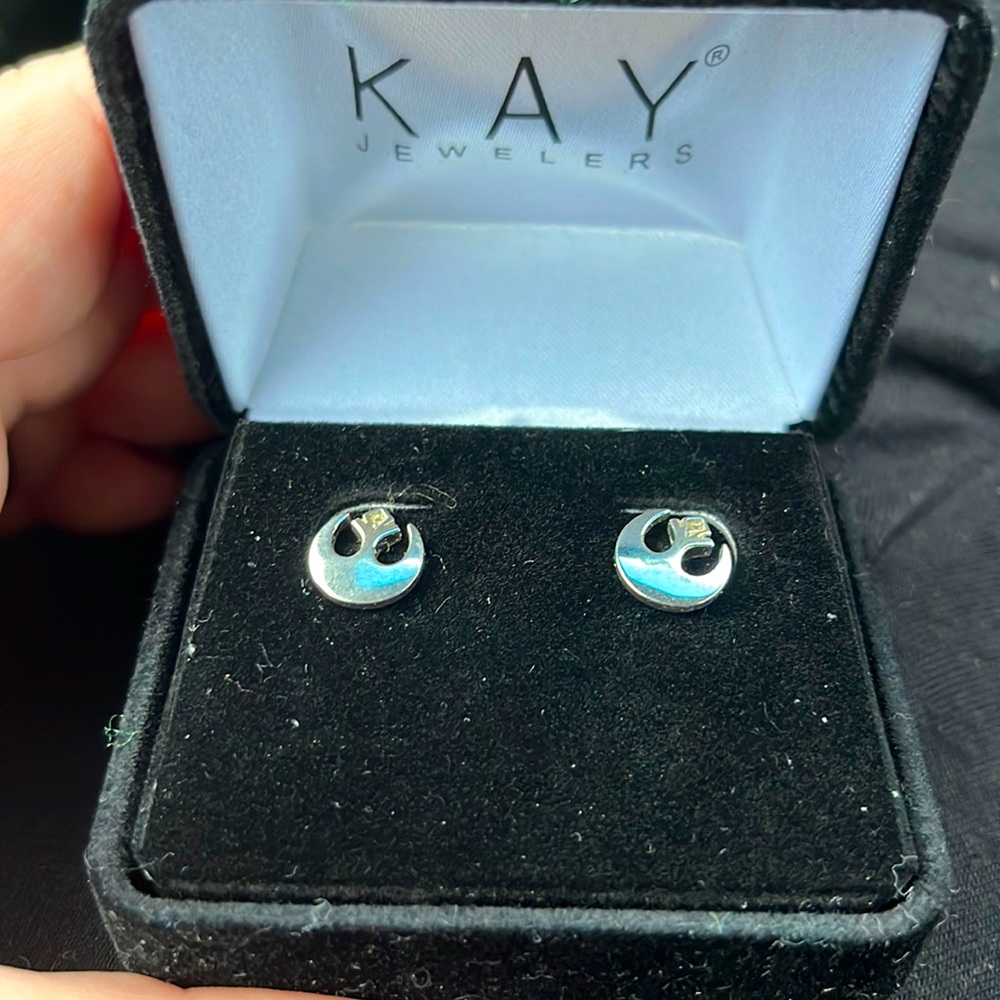 Silver Star Wars earrings with small diamonds.